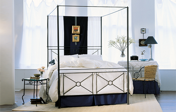 Campaign queen canopy bed - high footboard