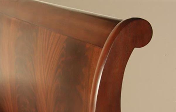 Stratford sleigh bed flame mahogany finish detail
