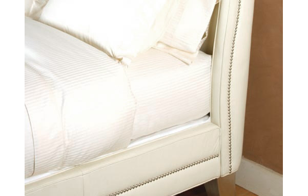 Wing white leather upholstered rail details
