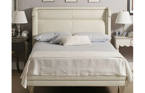 Wing white leather bed front view
