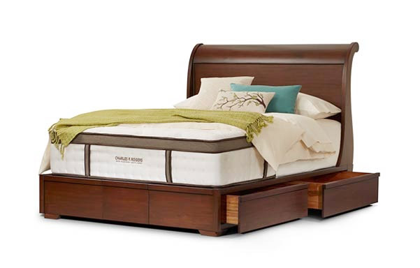 Sleigh queen platform bed with drawers open
