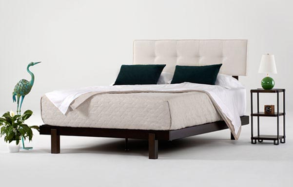 Alana bed in dark brown mahogany with natural white upholstered headrest