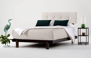 Alana bed in dark brown mahogany with natural white upholstered headrest